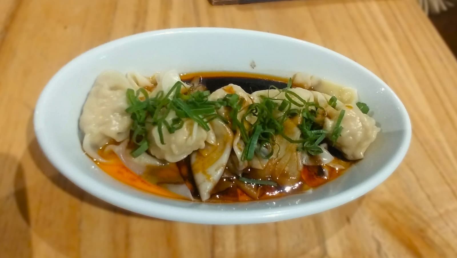 Dumplings in a sour and spicy sauce